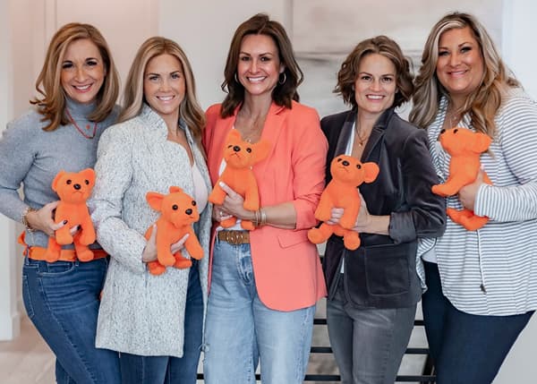 NextHomies holding Luke stuffed animals